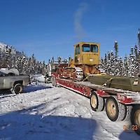 D6 dozer and boat on flatbed at Mon Property