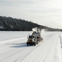 Heavy equipment haul to Mon mine site on winter road - March 2021