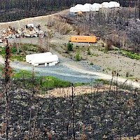 View NE - Tent Camp, Sewage Treatment, Fuel Tanks, Remains of Burnt Trailer Camp - 2024